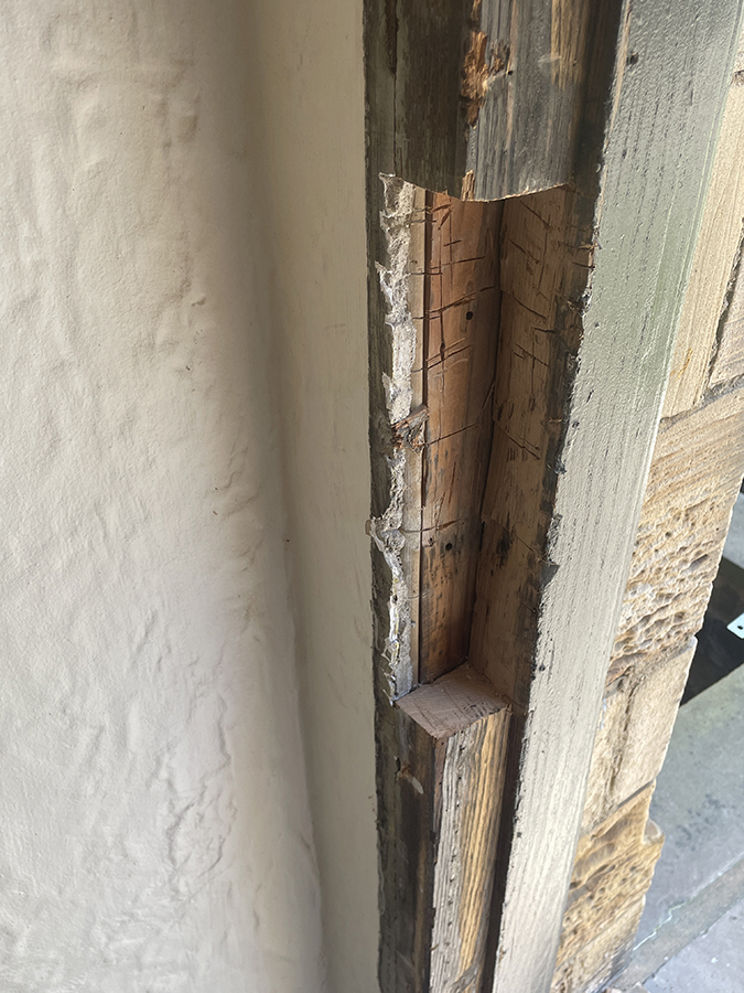 Beginning to repair old door frame